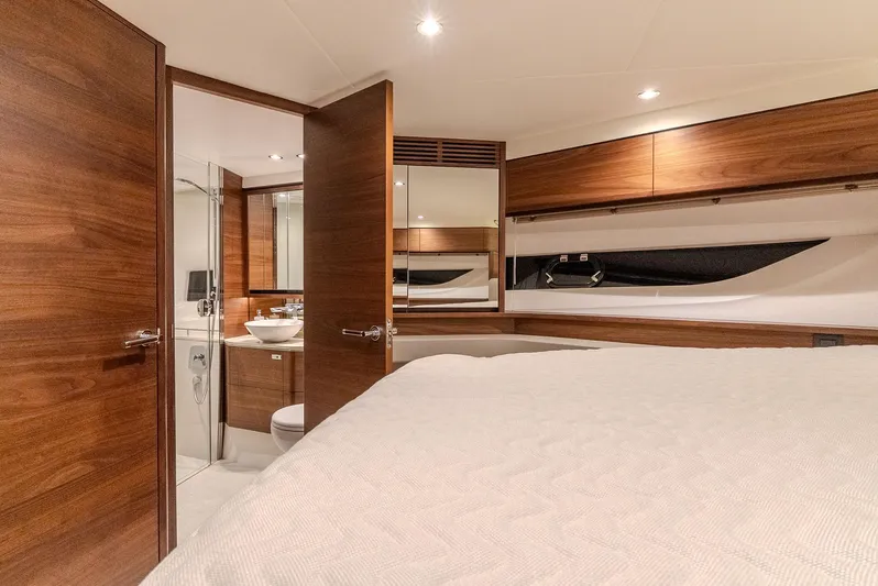  Yacht Photos Pics Luxurious interior of 2024 Princess F55 yacht, featuring elegant wood finishes and modern amenities.