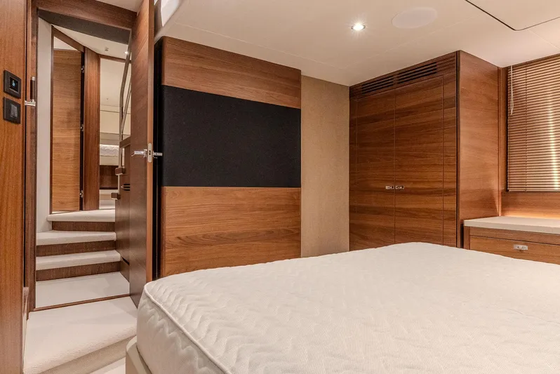  Yacht Photos Pics Luxurious interior of 2024 Princess F55 yacht with elegant wood finishes and modern design.