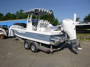 2024 Ranger 2360 Bay Ranger boat on trailer, featuring sleek design and powerful outboard motor.