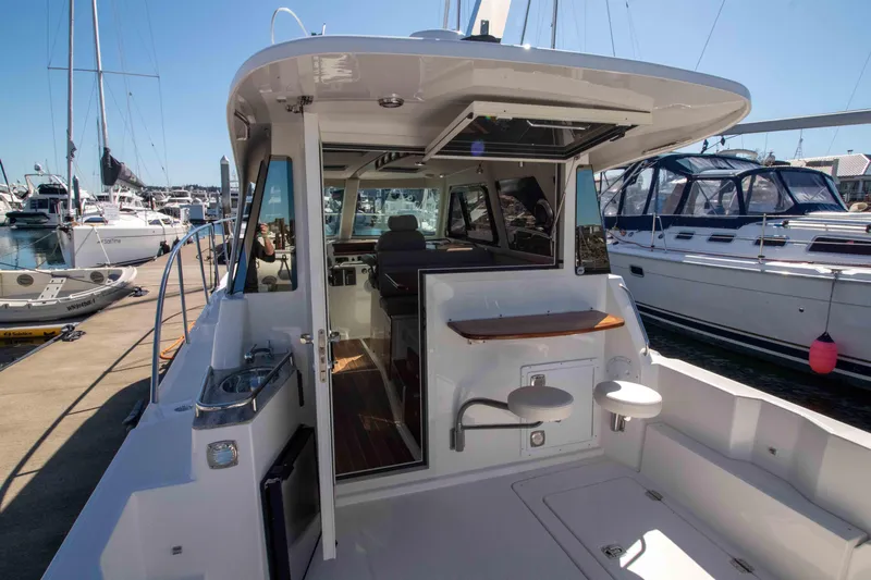  Yacht Photos Pics Modern Aspen C100 yacht interior, docked at marina, showcasing sleek design and spacious layout.