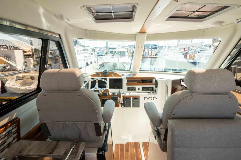  Yacht Photos Pics Interior of 2026 Aspen C100 boat with modern helm and seating.