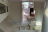 Interior of a 1999 Custom Open 50 sailboat, featuring a minimalist cabin design.