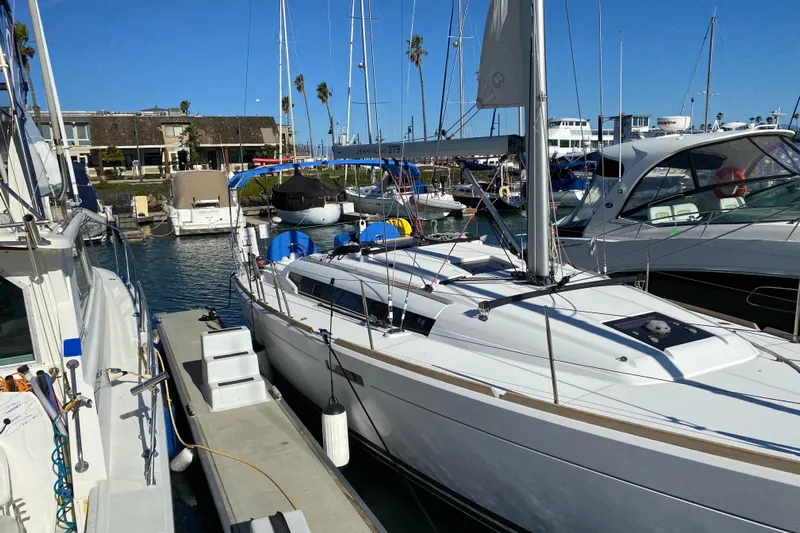  Yacht Photos Pics 2014 Jeanneau 379 sailboat docked at marina under clear blue sky.