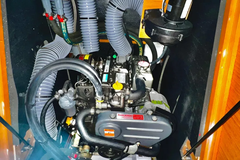 Yacht Photos Pics Engine compartment of a 2014 Jeanneau 379 sailboat, showcasing detailed mechanical components.