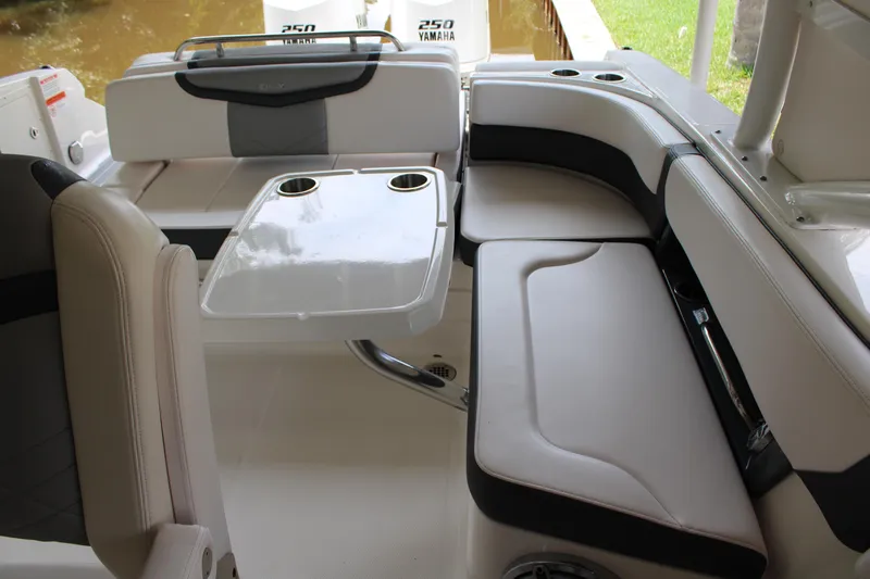  Yacht Photos Pics 2021 Chaparral 280 OSX boat interior with seating and table setup.