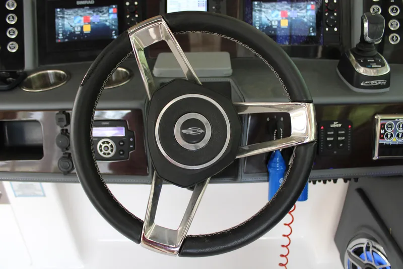  Yacht Photos Pics Steering wheel and dashboard of 2021 Chaparral 280 OSX boat.