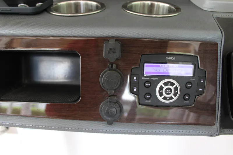  Yacht Photos Pics 2021 Chaparral 280 OSX dashboard with Clarion audio system and cup holders.