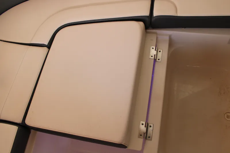  Yacht Photos Pics 2021 Chaparral 280 OSX boat seat with storage compartment and beige upholstery.