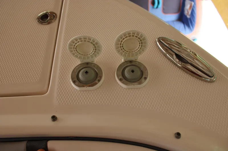  Yacht Photos Pics 2021 Chaparral 280 OSX boat deck with open hatches and chrome handle.