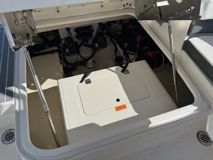  Yacht Photos Pics Open engine compartment of 2021 Chaparral 280 OSX boat, showing internal components and wiring.