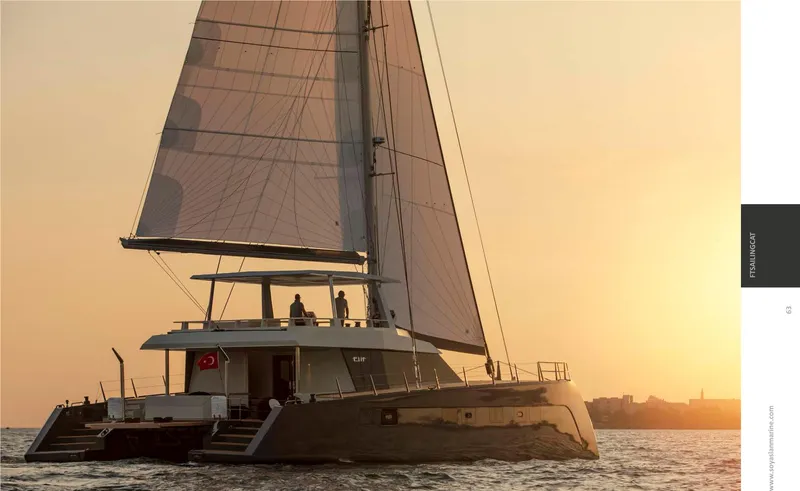 Elif Yacht Photos Pics Sailing catamaran Soyaslan CAT63, 2022 model, at sunset on the open sea.
