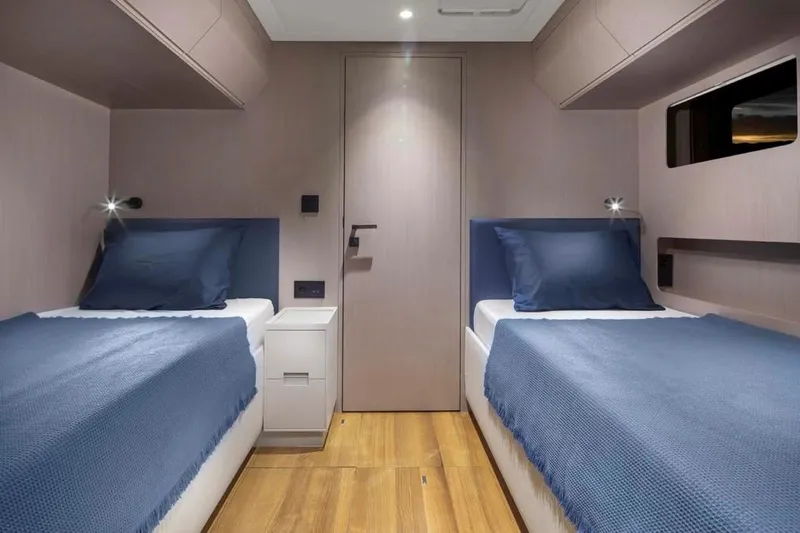 Elif Yacht Photos Pics Twin cabin with blue bedding in 2022 Soyaslan CAT63 yacht.