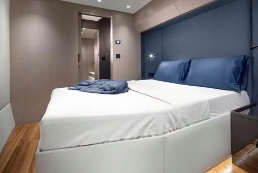 Elif Yacht Photos Pics Luxurious bedroom interior on Soyaslan CAT63 yacht, featuring modern design and elegant bedding.