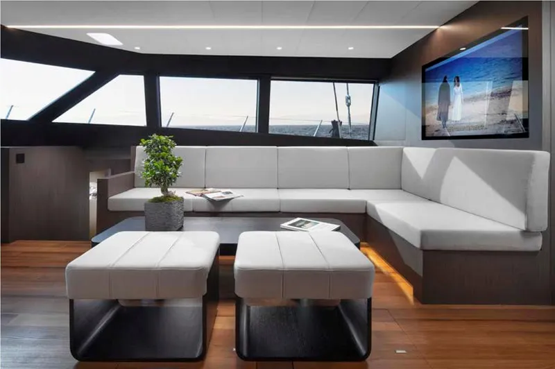 Elif Yacht Photos Pics Luxurious Soyaslan CAT63 yacht interior, 2022 model, featuring modern seating and large windows.