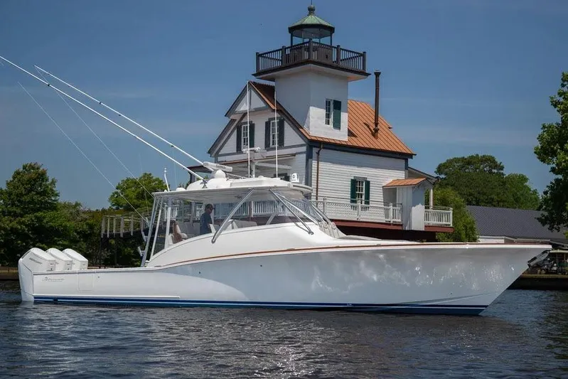 Kingston Grey Yacht Photos Pics Manufacturer Provided Image: 2026 Albemarle 41 Carolinian Fisharound Express yacht near a historic lighthouse.