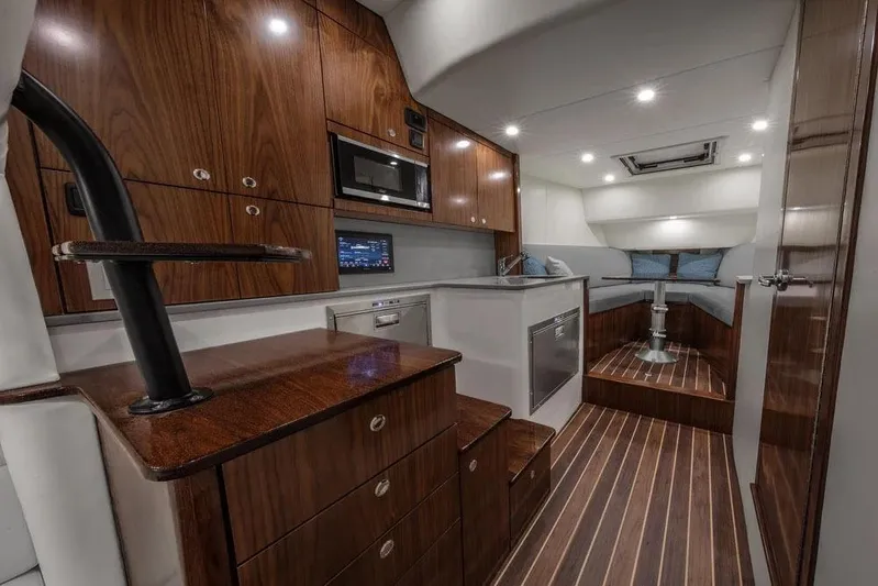 Kingston Grey Yacht Photos Pics Manufacturer Provided Image: Luxurious interior of 2026 Albemarle 41 Carolinian Fisharound Express with wood finishes and modern amenities.