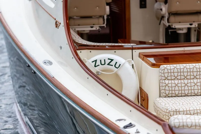 Zuzu Yacht Photos Pics 2004 Hinckley Picnic Boat EP with elegant seating and life preserver.