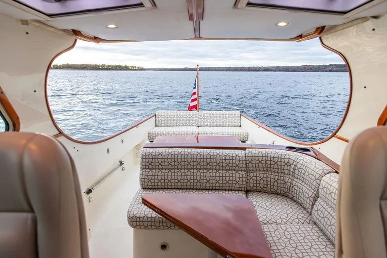 Zuzu Yacht Photos Pics 2004 Hinckley Picnic Boat EP interior with elegant seating and scenic water view.