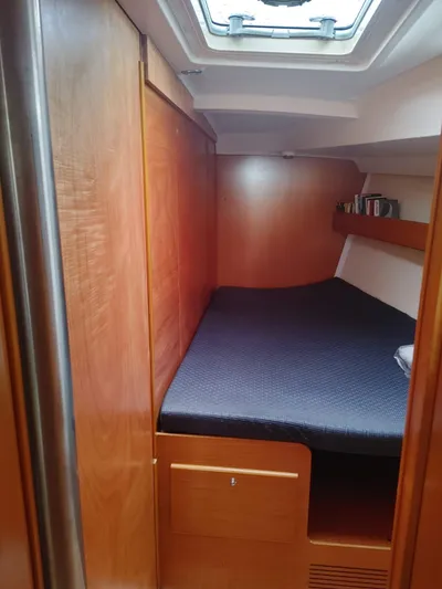 Blue Nomade Yacht Photos Pics 2006 Beneteau Cyclades 50.4 cabin interior with wooden finish and skylight.