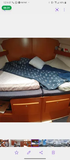 Blue Nomade Yacht Photos Pics Interior cabin of 2006 Beneteau Cyclades 50.4 yacht with cozy bedding.