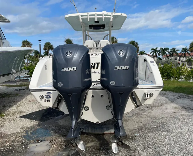 Intensity 2 Yacht Photos Pics 2015 Century 2901 Center Console boat with twin Yamaha 300 engines, parked outdoors.
