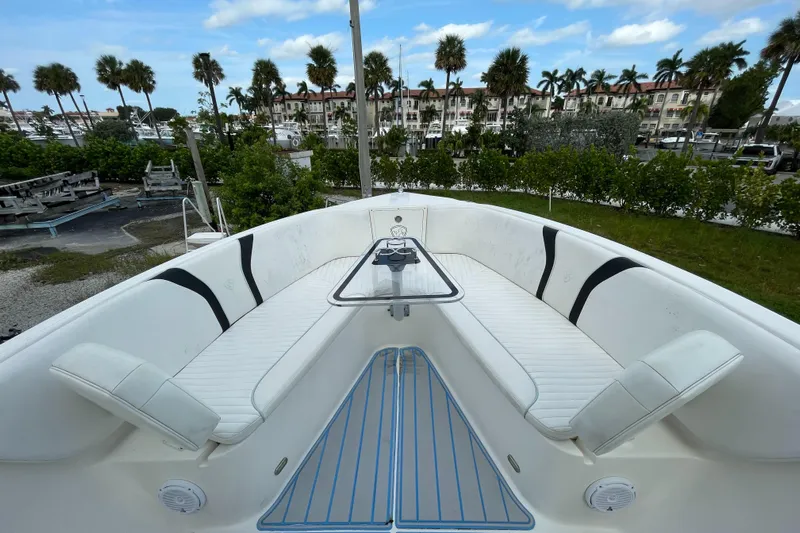 Intensity 2 Yacht Photos Pics 2015 Century 2901 Center Console boat with spacious seating and scenic marina backdrop.