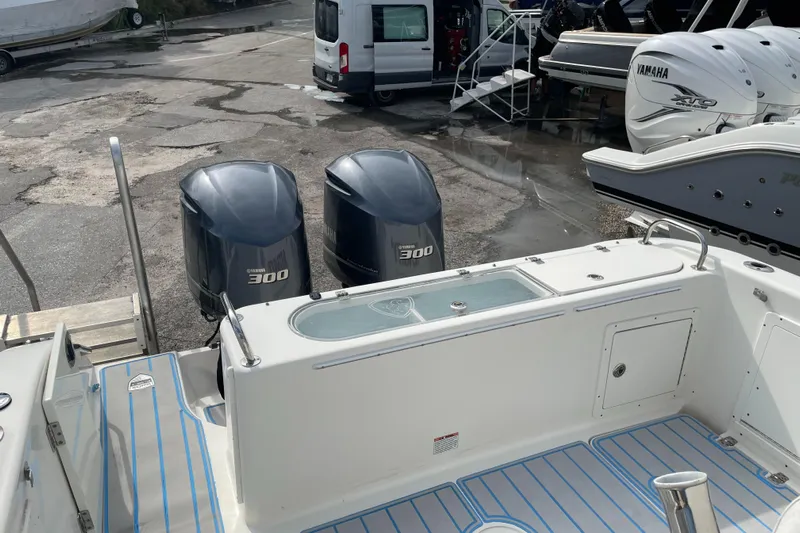 Intensity 2 Yacht Photos Pics 2015 Century 2901 Center Console boat with twin Yamaha 300 engines, docked outdoors.