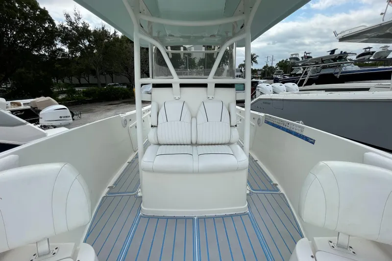 Intensity 2 Yacht Photos Pics 2015 Century 2901 Center Console boat with white seating and spacious deck.