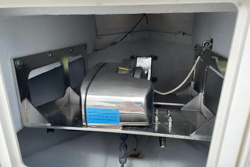 Intensity 2 Yacht Photos Pics 2015 Century 2901 Center Console anchor storage compartment with metal fittings and wiring.