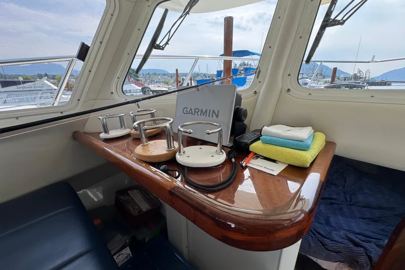  Yacht Photos Pics 2017 Ocean Sport Roamer interior with Garmin equipment and marina view.