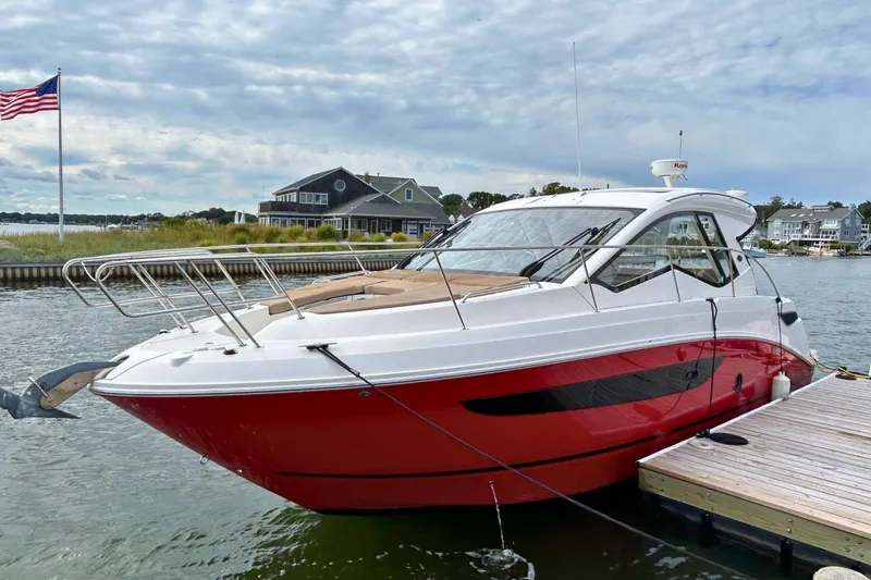  Yacht Photos Pics 2017 Sea Ray Sundancer 350 Coupe docked, featuring sleek red and white design.