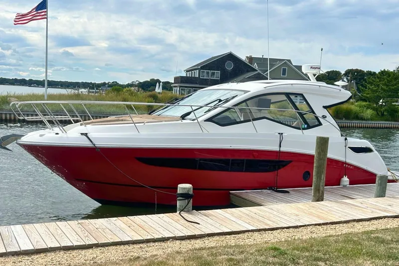  Yacht Photos Pics 2017 Sea Ray Sundancer 350 Coupe docked, featuring sleek red and white design.