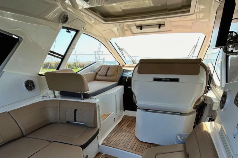  Yacht Photos Pics Luxurious interior of 2017 Sea Ray Sundancer 350 Coupe with plush seating and modern design.