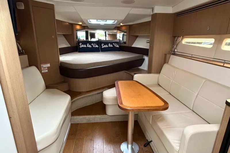  Yacht Photos Pics Luxurious interior of 2017 Sea Ray Sundancer 350 Coupe with cozy seating and elegant decor.