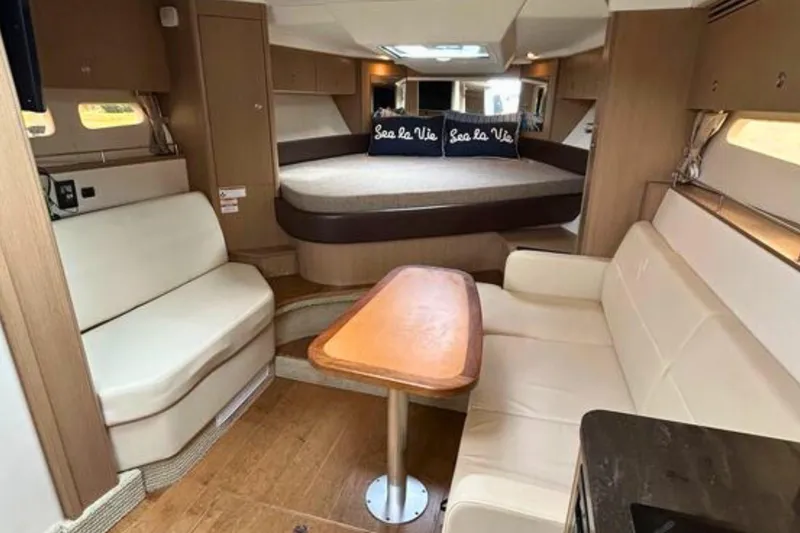  Yacht Photos Pics Luxurious interior of 2017 Sea Ray Sundancer 350 Coupe with cozy seating and elegant design.