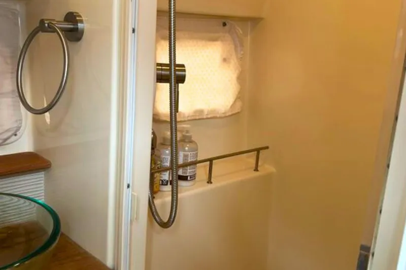  Yacht Photos Pics Bathroom interior of 2017 Sea Ray Sundancer 350 Coupe with shower and glass sink.