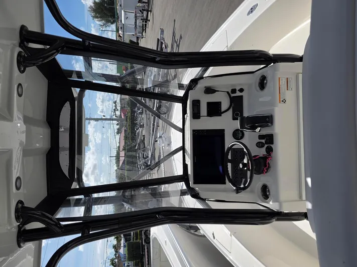 Seavee Yacht Photos Pics 2023 SeaVee 270Z boat console with steering wheel and navigation equipment.