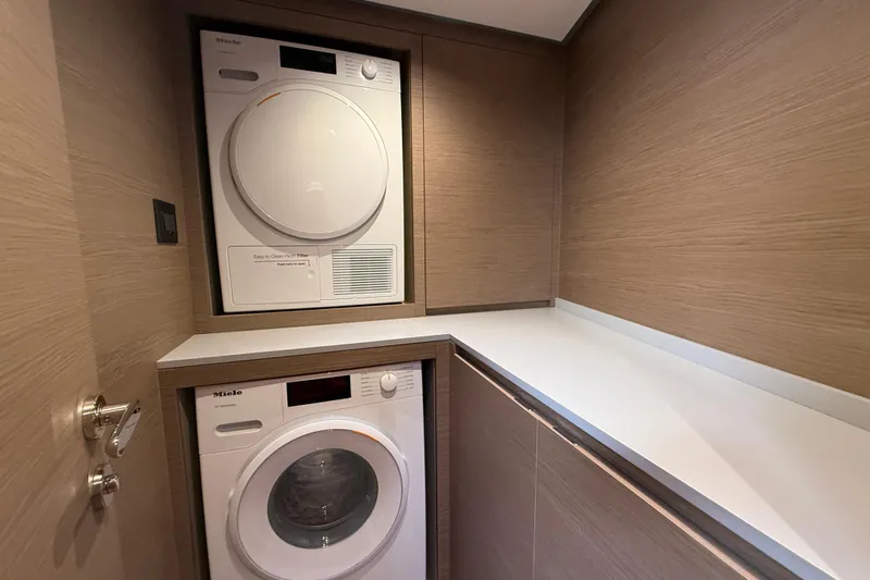  Yacht Photos Pics Laundry area with Miele appliances on Pardo Yachts GT75, 2026 model.