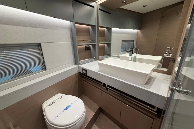  Yacht Photos Pics Luxurious bathroom in 2026 Pardo Yachts GT75, featuring modern sink and elegant design.