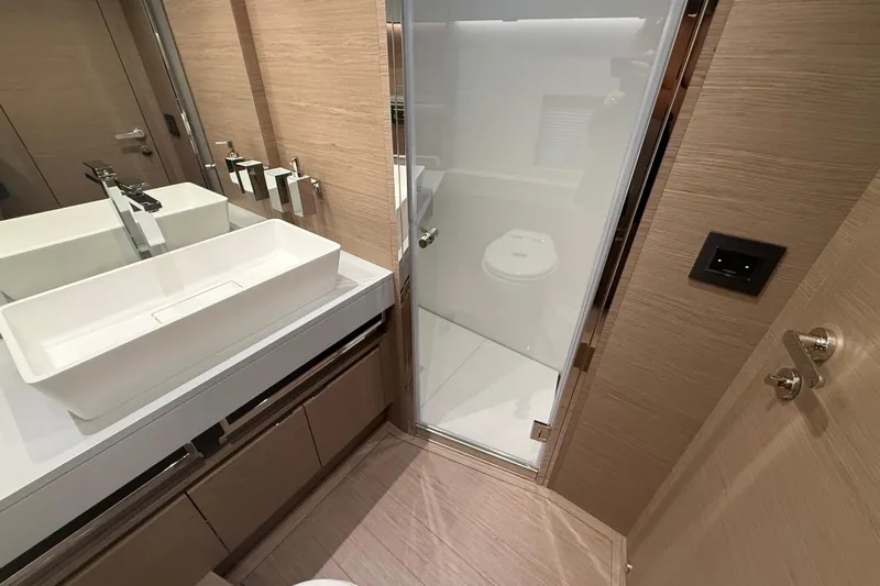 Yacht Photos Pics Luxurious bathroom in 2026 Pardo Yachts GT75, featuring modern sink and shower.