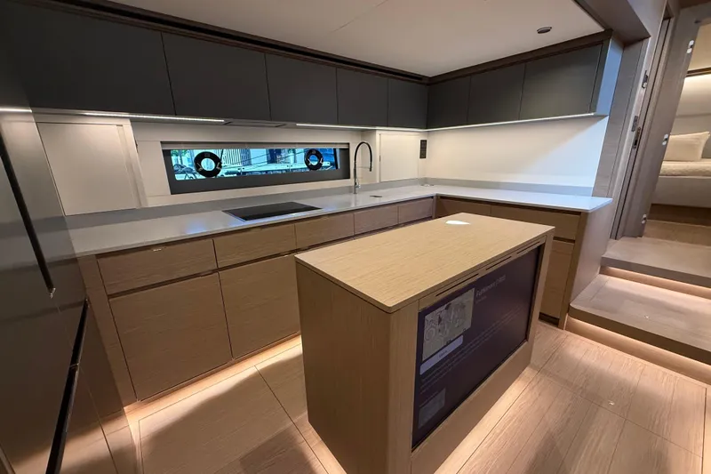  Yacht Photos Pics Modern kitchen interior of 2026 Pardo Yachts GT75, featuring sleek cabinetry and ambient lighting.