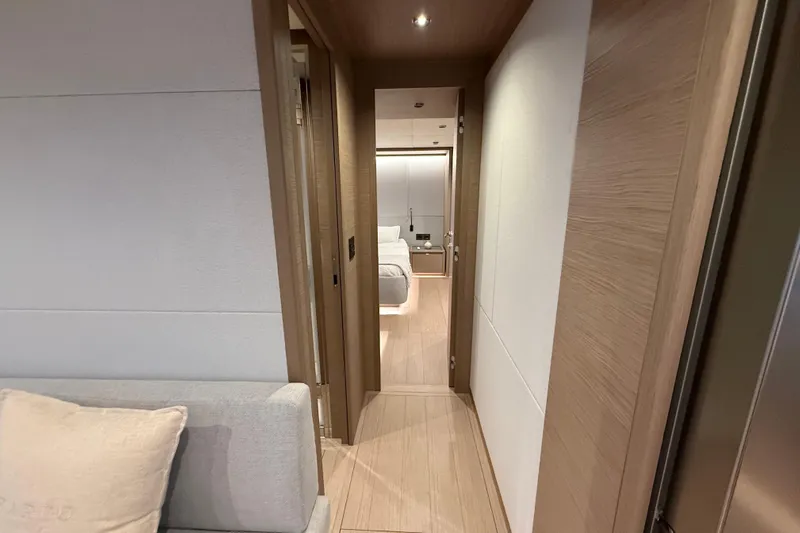  Yacht Photos Pics Interior hallway of 2026 Pardo Yachts GT75, featuring modern wood paneling and cozy design.