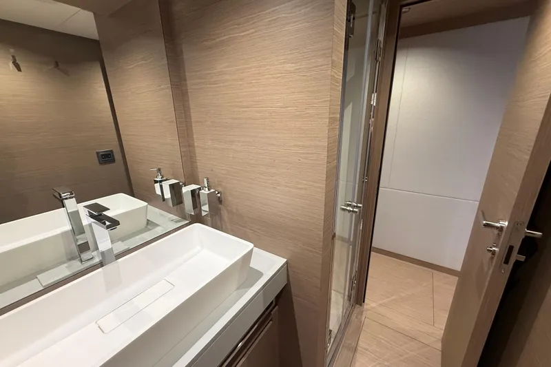  Yacht Photos Pics Luxurious bathroom interior of 2026 Pardo Yachts GT75 with modern fixtures and wood accents.
