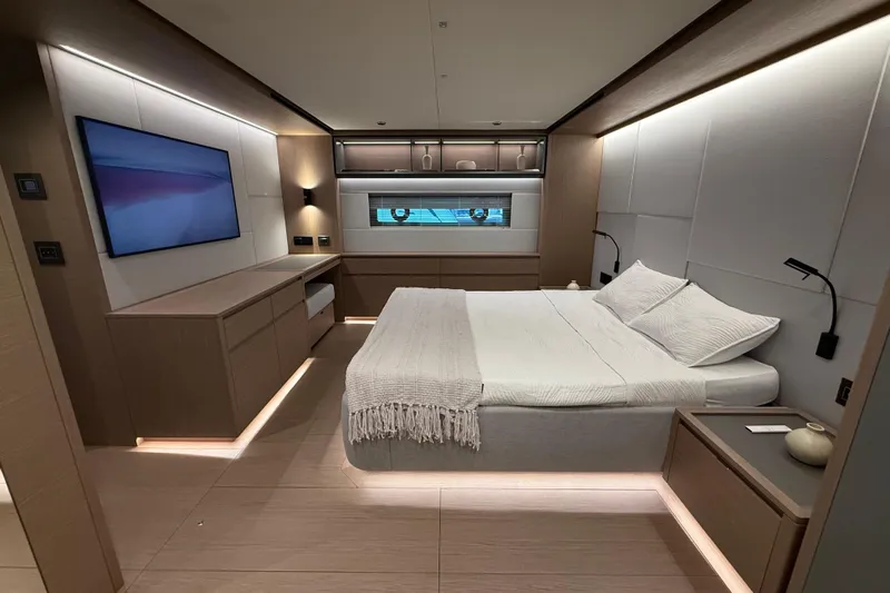  Yacht Photos Pics Luxurious bedroom interior of 2026 Pardo Yachts GT75, featuring modern design and ambient lighting.