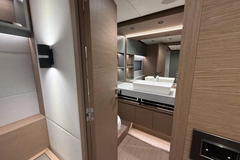  Yacht Photos Pics Luxurious bathroom interior of 2026 Pardo Yachts GT75, featuring modern fixtures and elegant wood finishes.