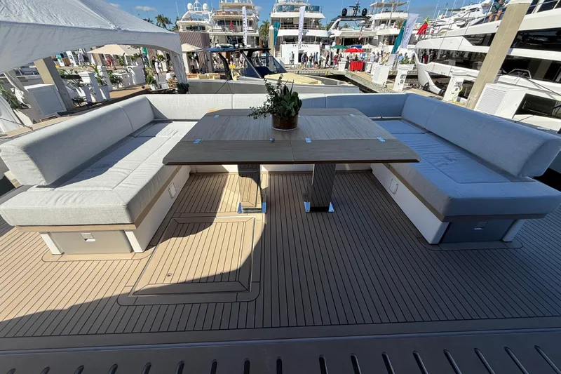  Yacht Photos Pics Luxurious seating area on 2026 Pardo Yachts GT75 with elegant wooden table.