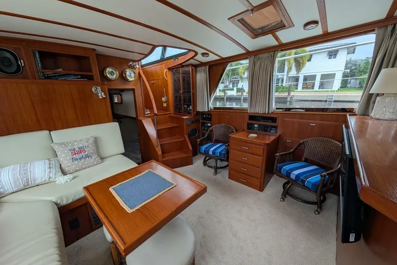 Just Right Yacht Photos Pics Interior of 2004 Dettling Express Cruiser with wood paneling and comfortable seating.