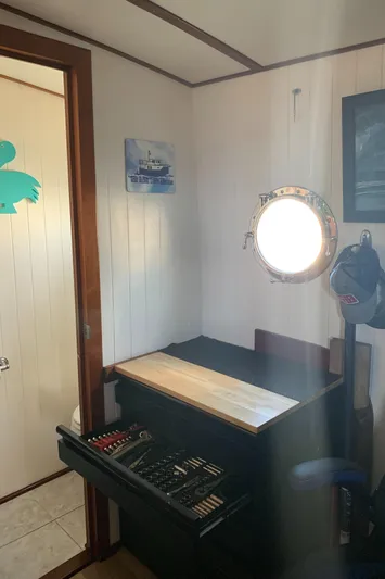 Lazy Days Yacht Photos Pics Interior of 2005 Great Harbour GH37 with porthole, desk, and art supplies.