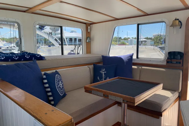 Lazy Days Yacht Photos Pics Interior of 2005 Great Harbour GH37 boat with cozy seating and nautical-themed decor.
