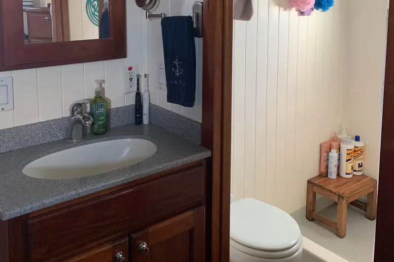 Lazy Days Yacht Photos Pics Bathroom interior of a 2005 Great Harbour GH37 boat with sink and shower.